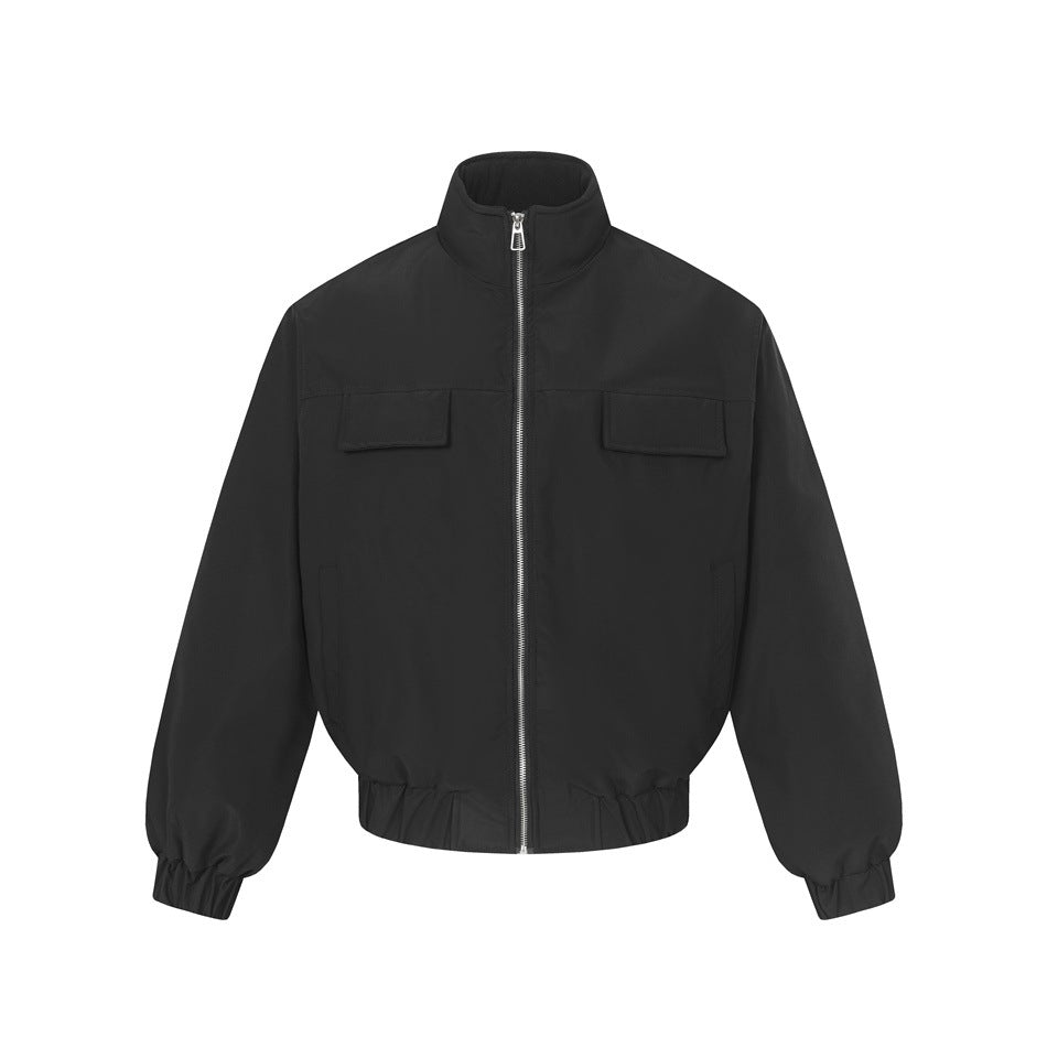 Black stand-collar bomber jacket, front view, with silver zipper, chest flap pockets and elastic cuffs and hem