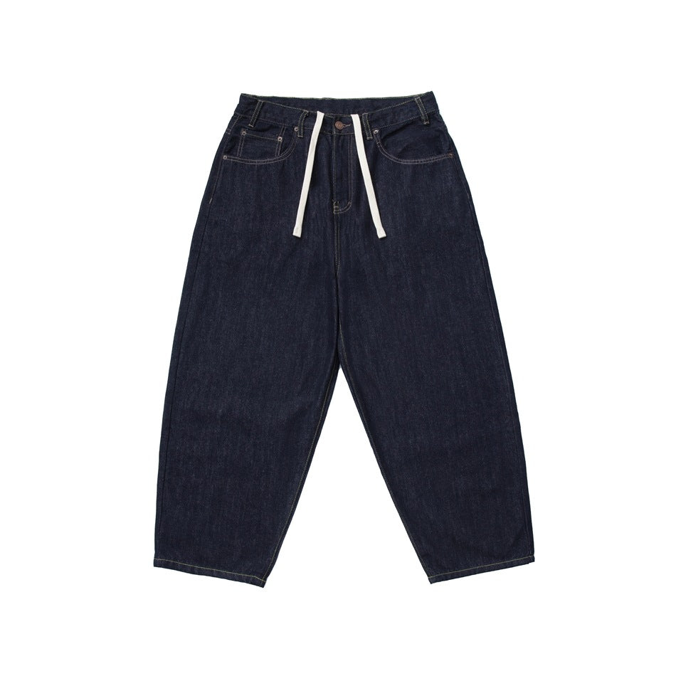 Dark indigo wide-leg cropped jeans, front view, with white drawcord and tan topstitching