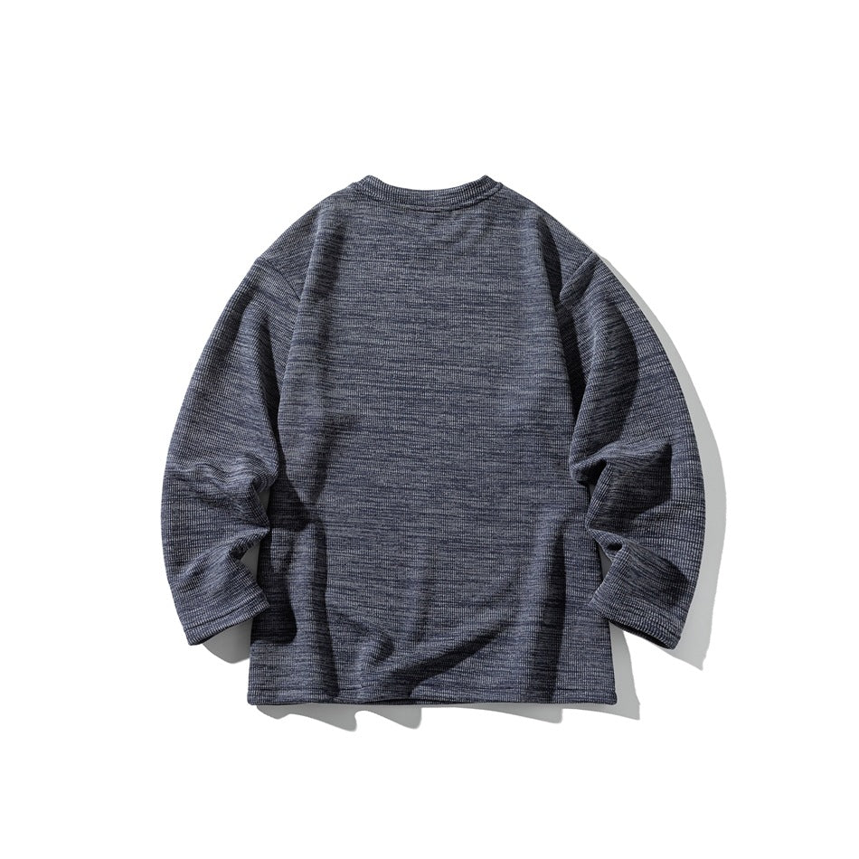 Flat-lay front of a charcoal gray heathered long-sleeve crewneck shirt on a white background.