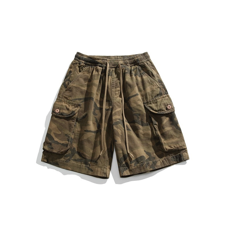 Camouflage cargo shorts flat lay with drawstring waistband and button-flap side cargo pockets
