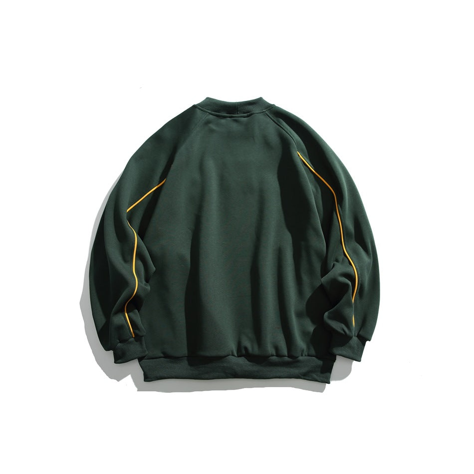 Back of a dark green crewneck sweatshirt with yellow piping along the raglan sleeves.