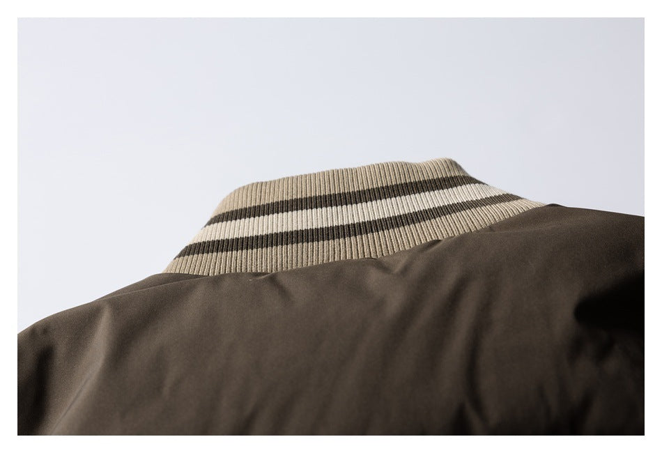 Close-up of a dark brown jacket collar with beige-and-dark striped ribbed trim.