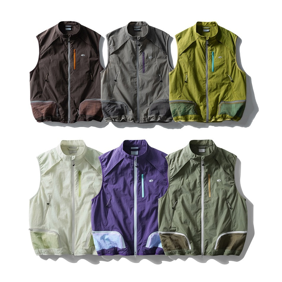 Six sleeveless zip-front utility vests displayed in dark brown, gray, lime, cream, purple and olive colorways.