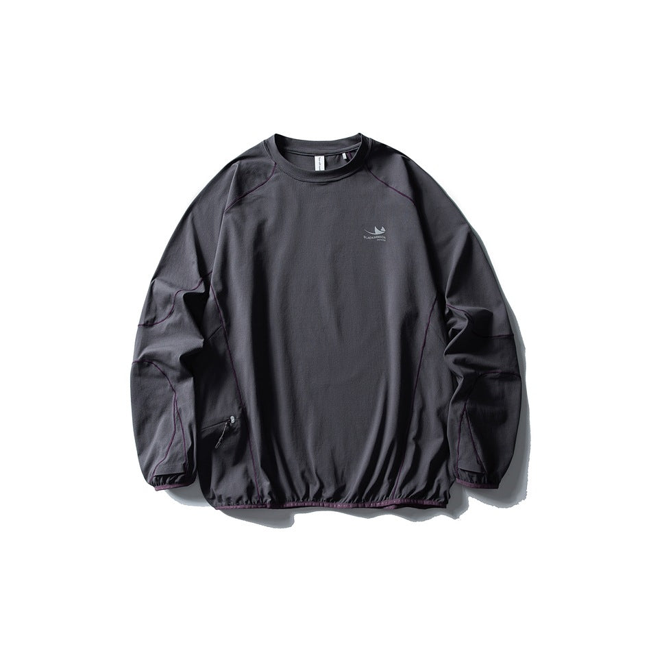 Charcoal gray long-sleeve crew-neck top flat lay with purple contrast topstitching and zip pocket