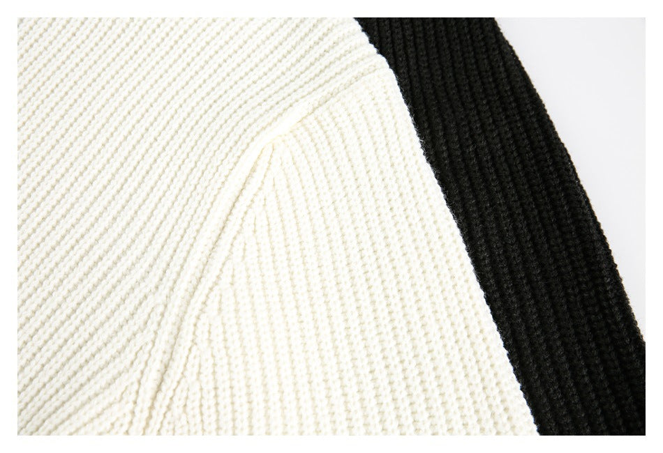 Close-up of cream chunky knit fabric beside a black knit section.