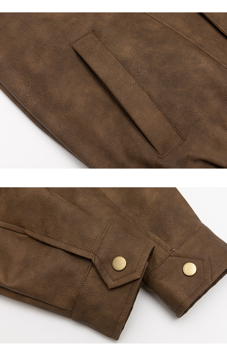 Close-up of a brown textured jacket showing a slit pocket and sleeve cuffs with brass-tone snap buttons.