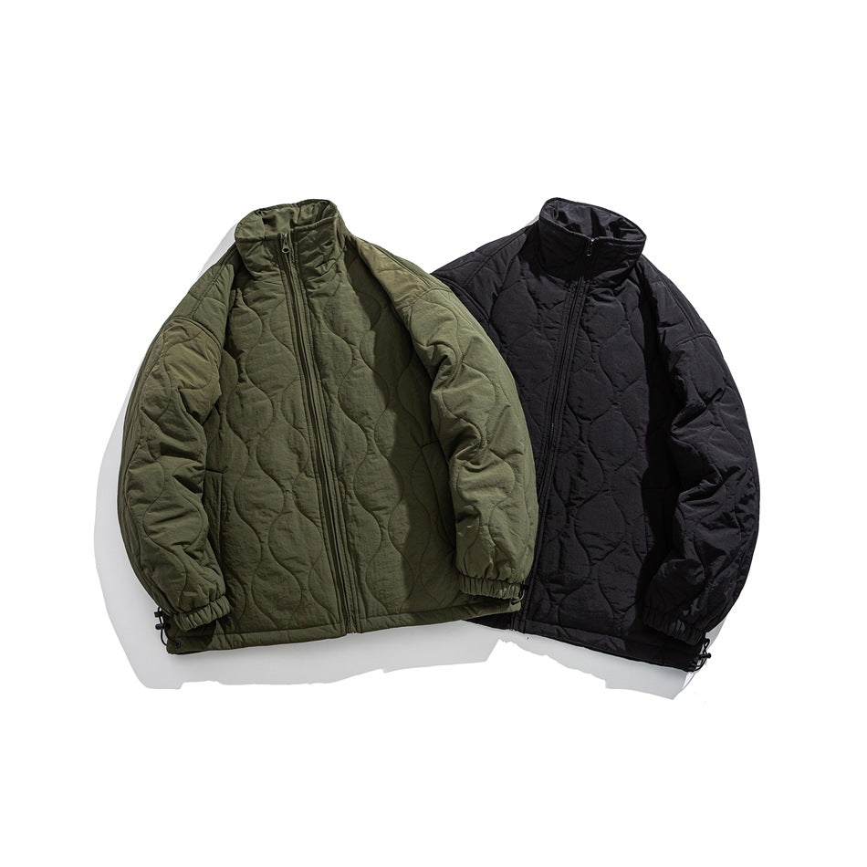 Two quilted zip jackets displayed together: one olive green and one black.