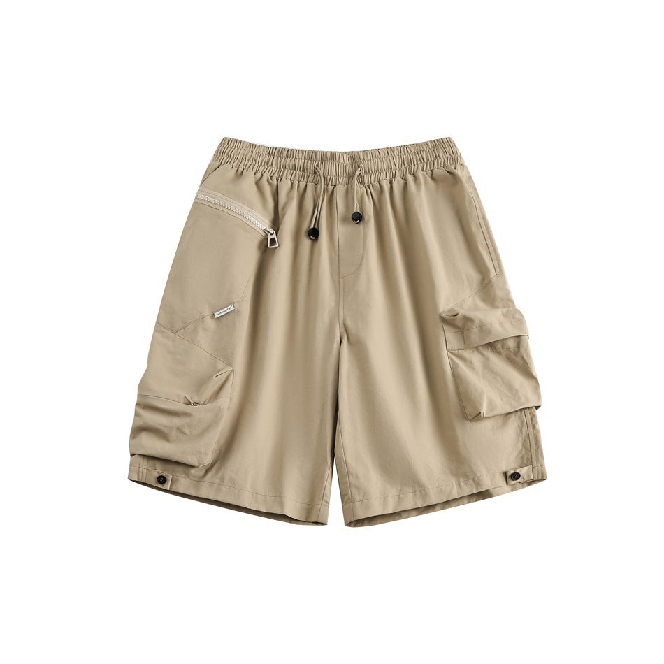 Khaki cargo shorts, front flat lay, with drawstring waist, diagonal zip pocket and large side flap pockets