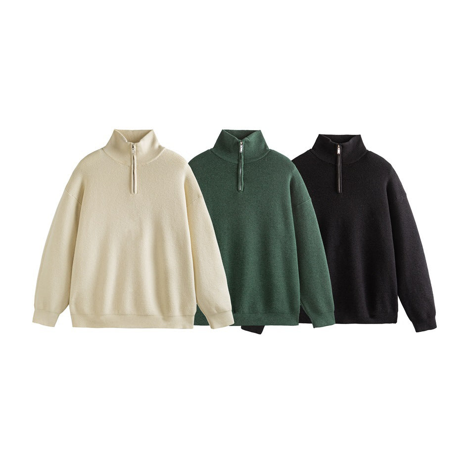 Three quarter-zip, high-collar pullovers shown together in ivory, dark green, and black.