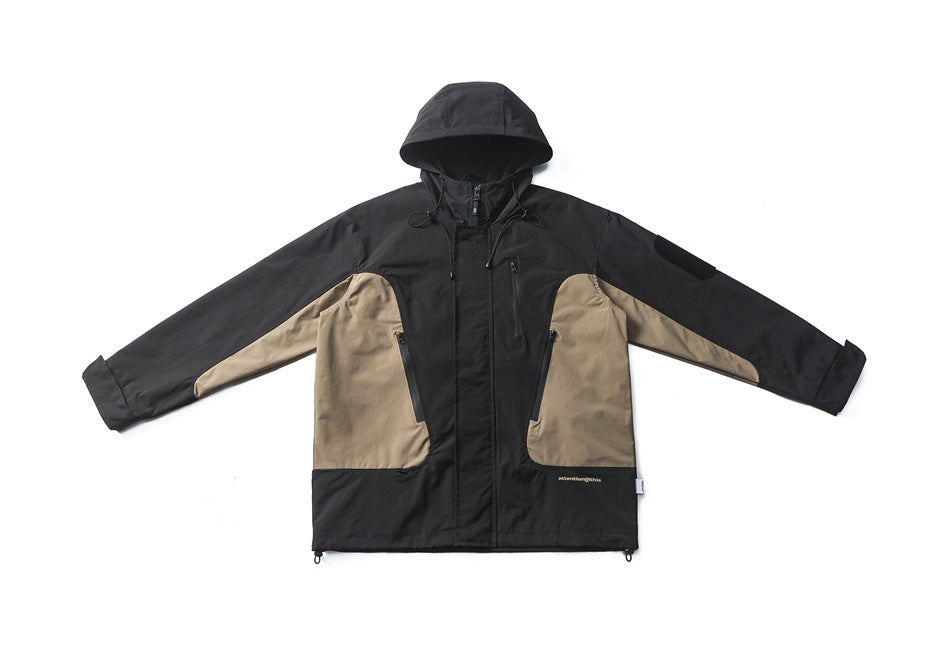 Black hooded jacket with khaki side panels, front zip, zippered pockets and hem drawcords, laid flat