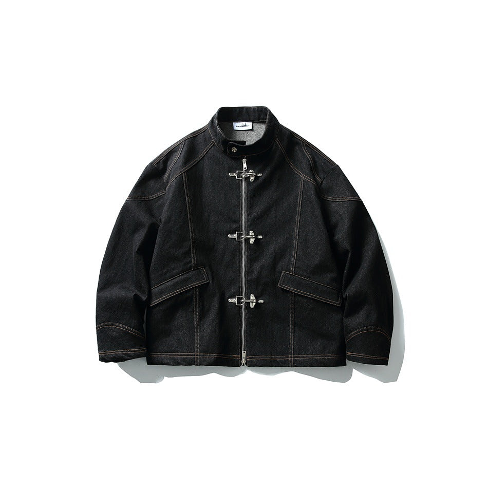 Black denim stand-collar jacket with three metal clasp closures, center zipper and orange contrast stitching, front view