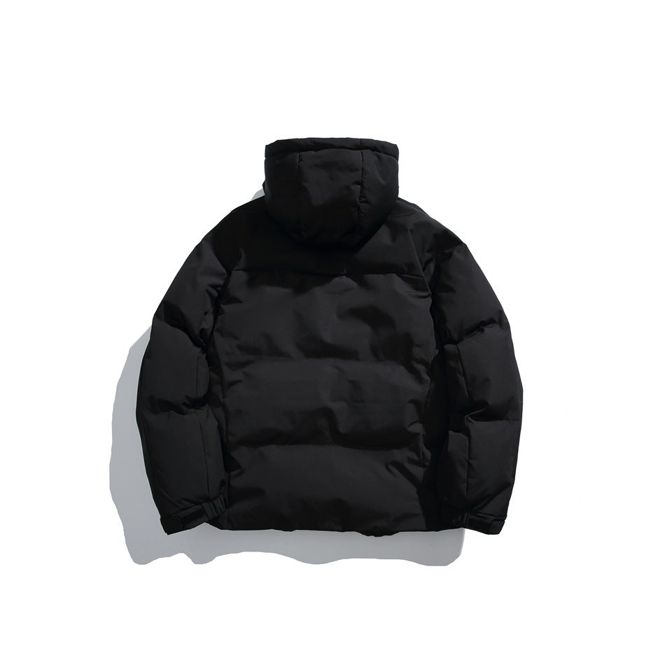 Back view of a black hooded puffer jacket laid flat against a white background.