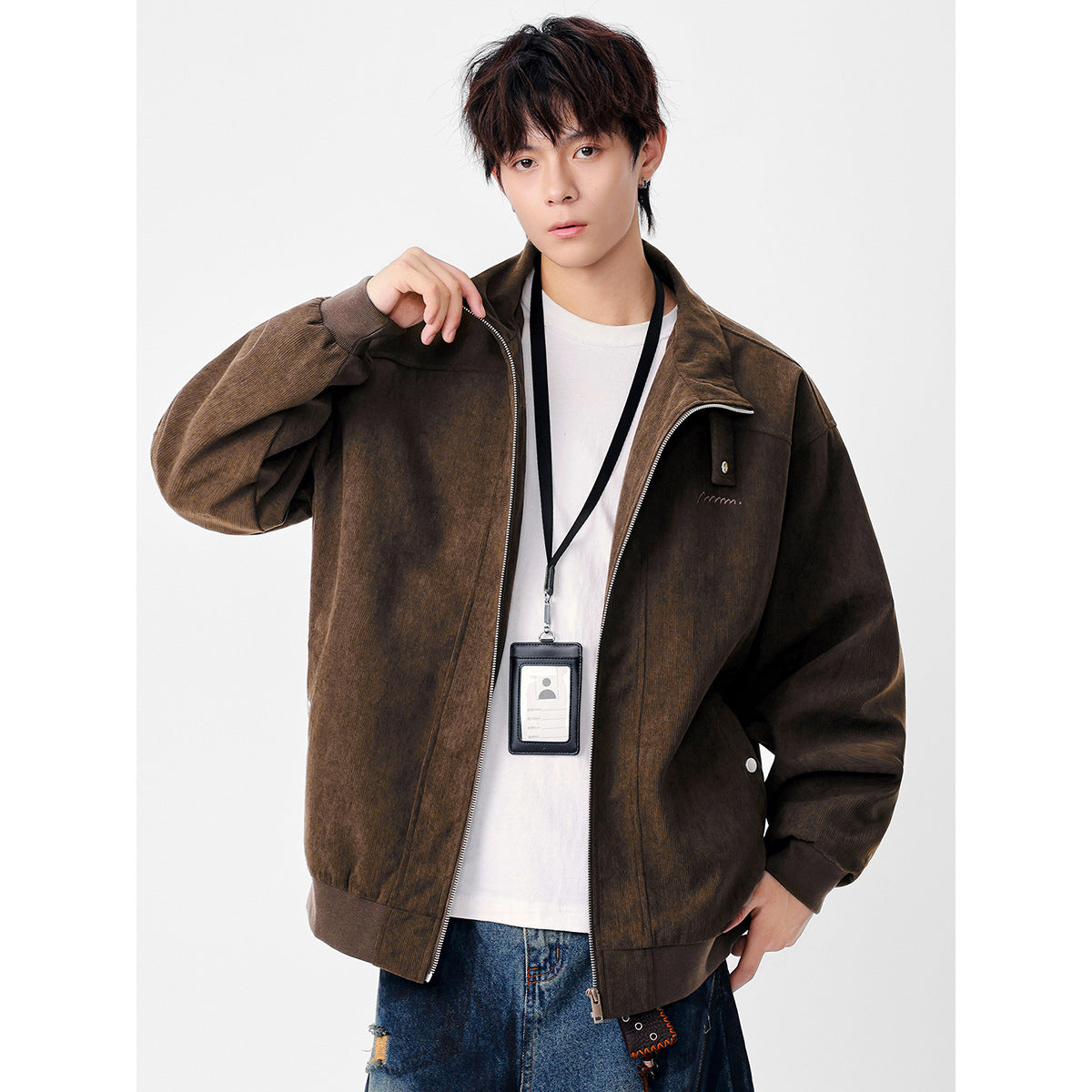 Model wearing a dark brown zip-front jacket with a high collar, oversized sleeves, and ribbed cuffs and hem.