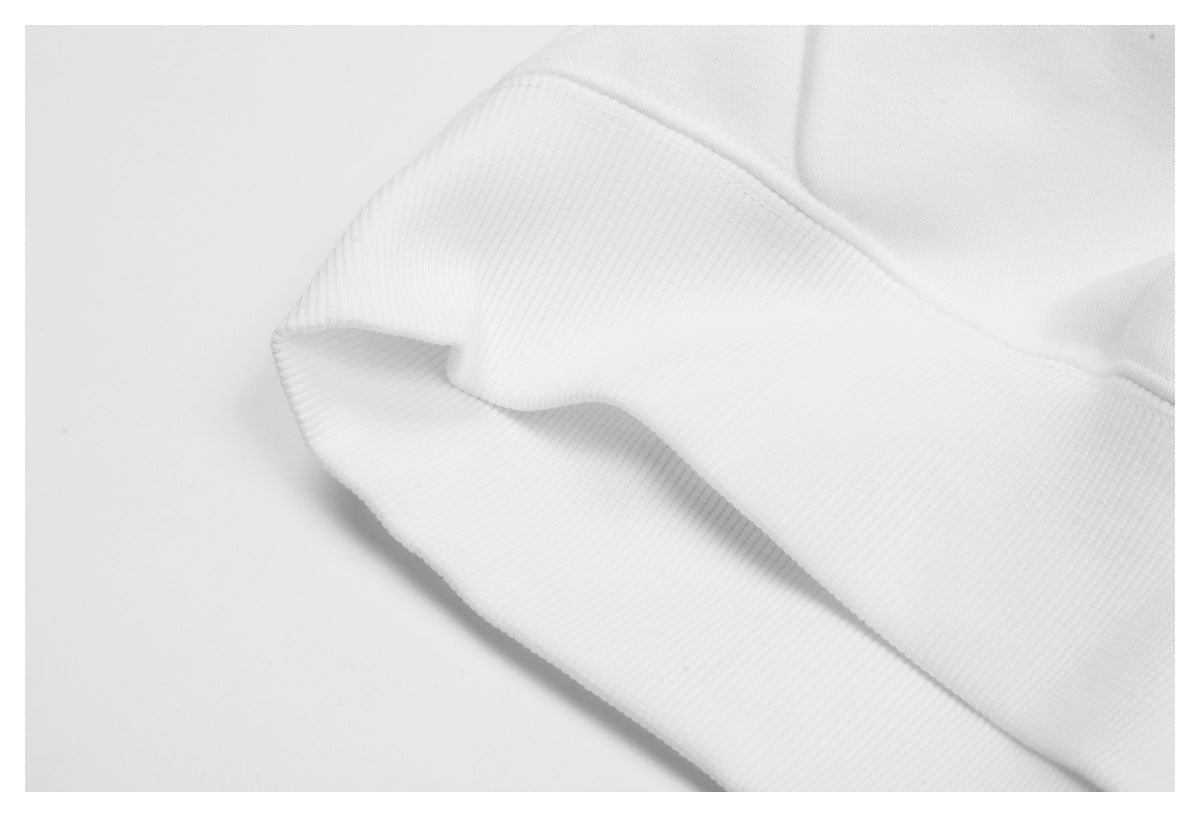 Close-up of a white ribbed garment band folded to show its edge and stitching.