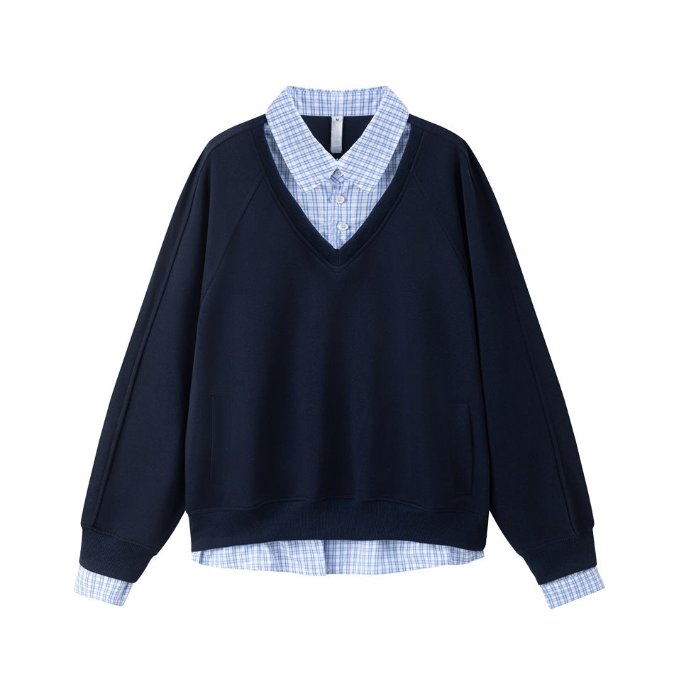 Navy V-neck raglan sweatshirt with light blue checked shirt collar, cuffs and hem layered underneath, flat front view