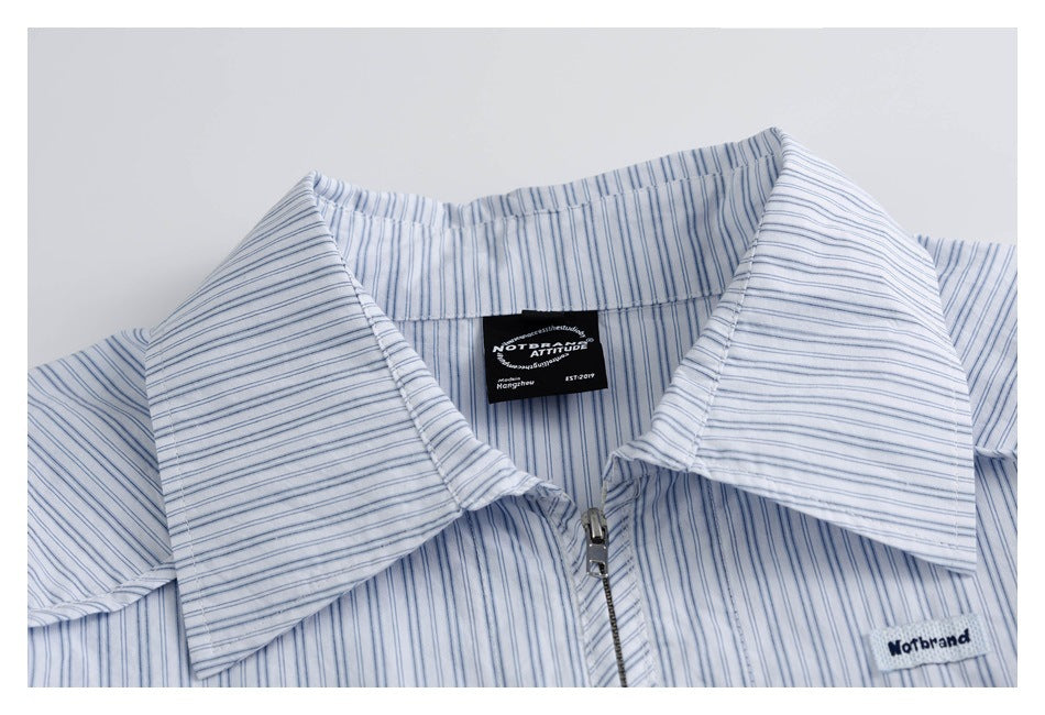 Blue-striped shirt collar and front zipper shown in close-up, with sewn-in labels.