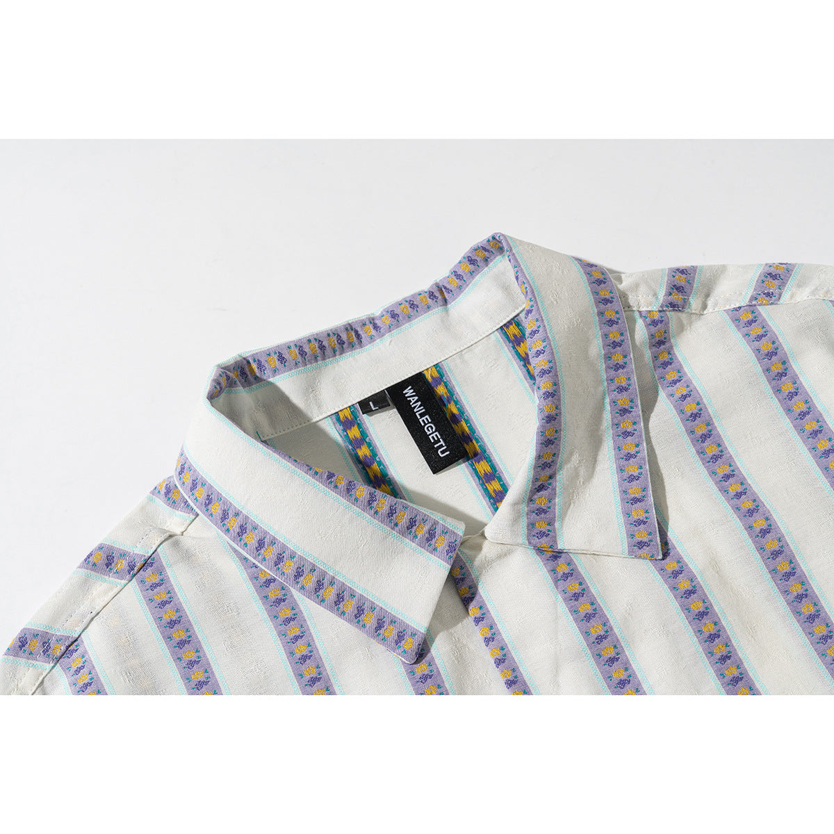 Close-up of an ivory shirt collar with purple floral stripe bands and thin turquoise edging.