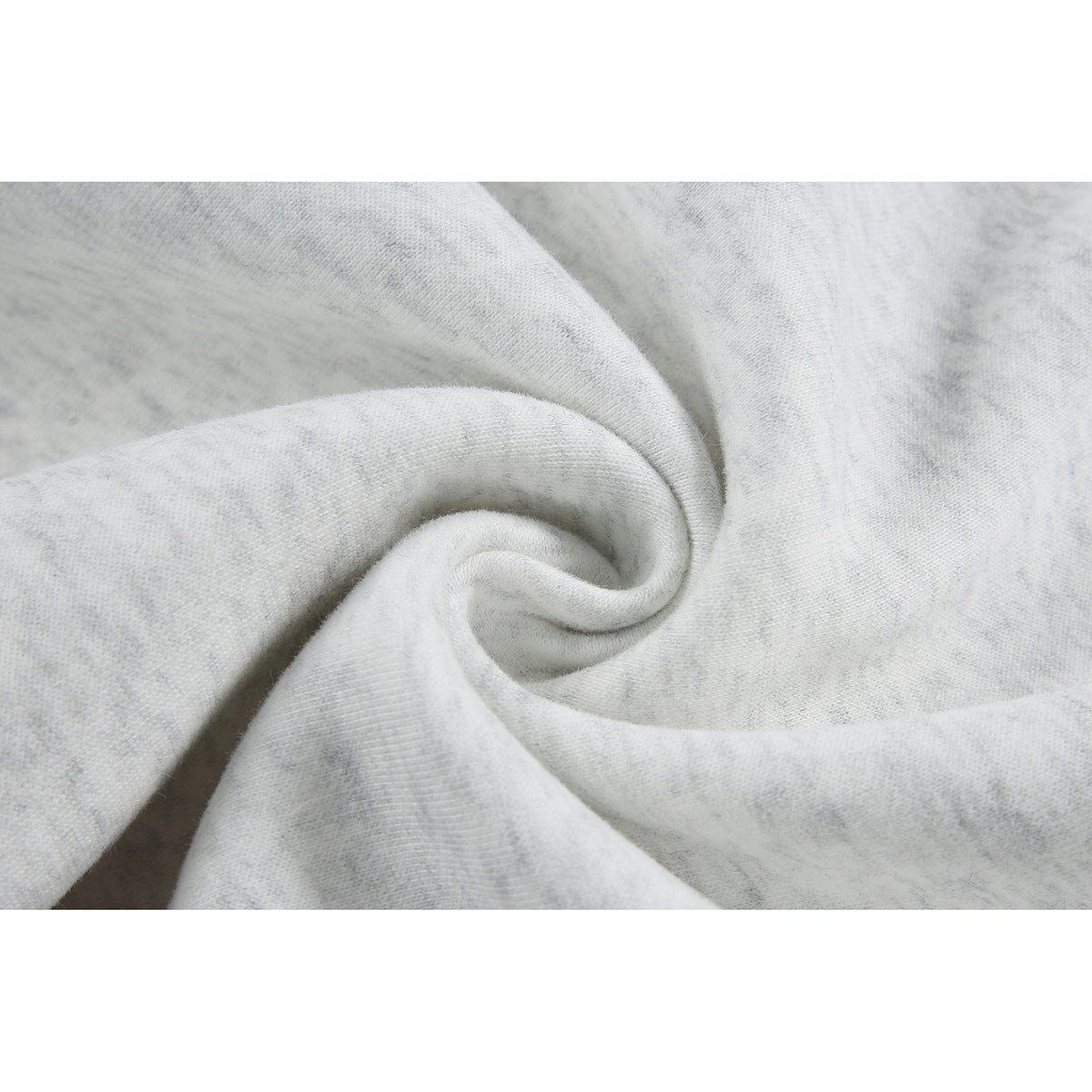 Close-up of light gray heathered fabric gathered into a swirl.