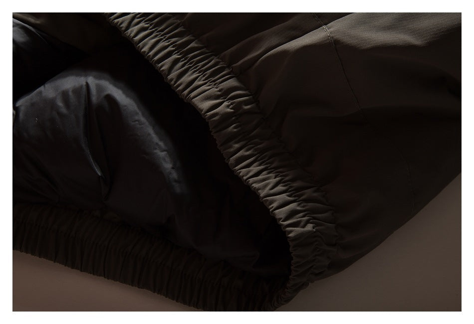 Close-up of the jacket's gathered elastic edge and dark inner lining.