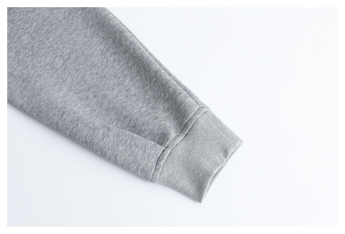 Close-up of a light gray sleeve ending in a ribbed cuff.