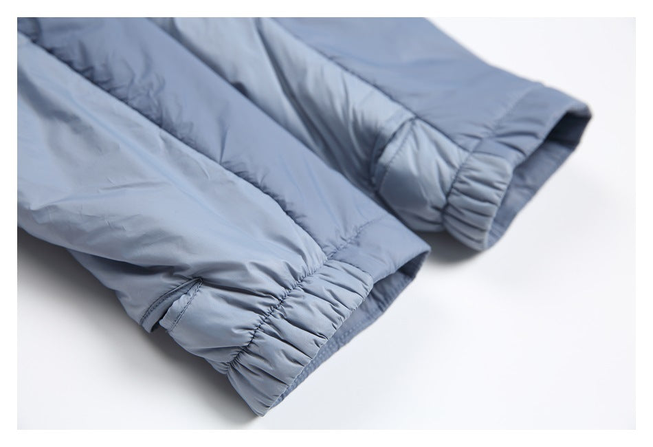 Close-up of both blue jacket sleeves, showing their gathered elastic cuffs.