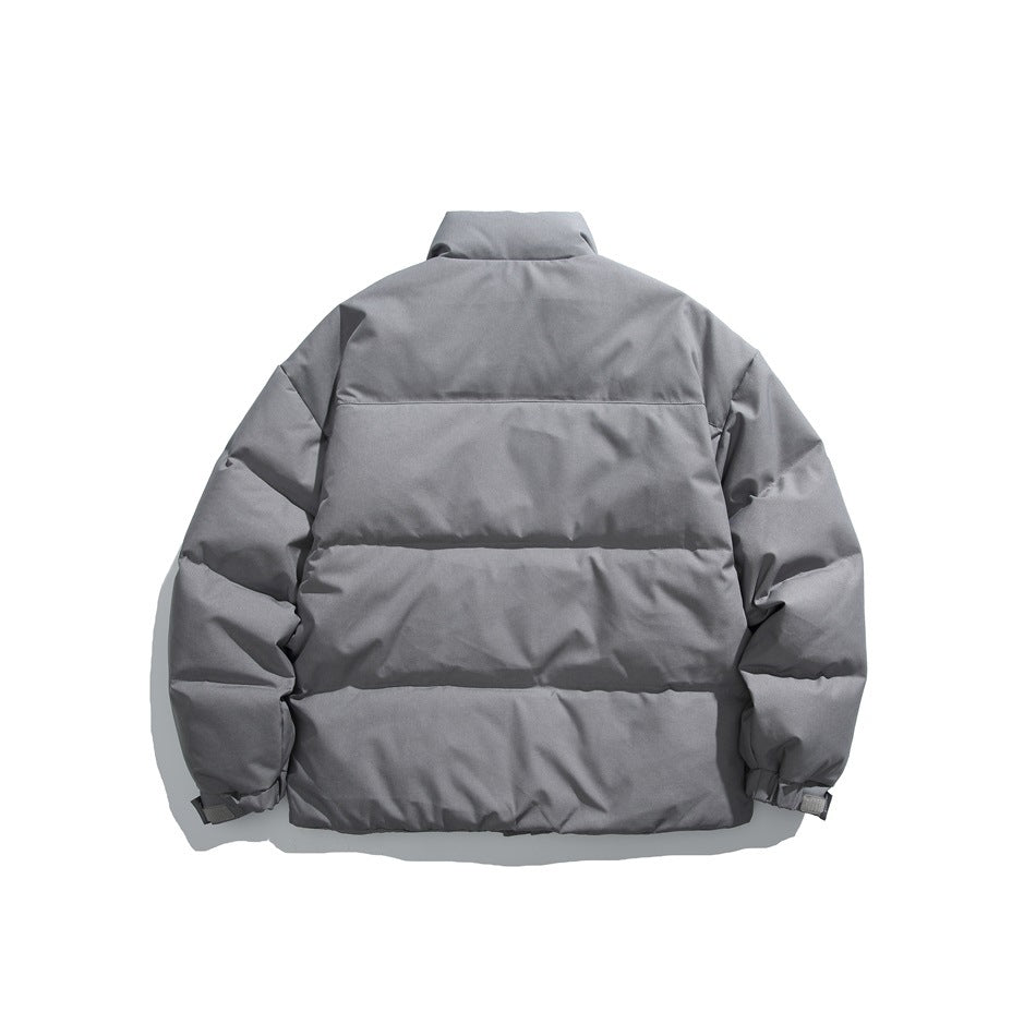 Back view of a gray padded jacket with horizontal quilting, a stand collar and elastic cuffs.