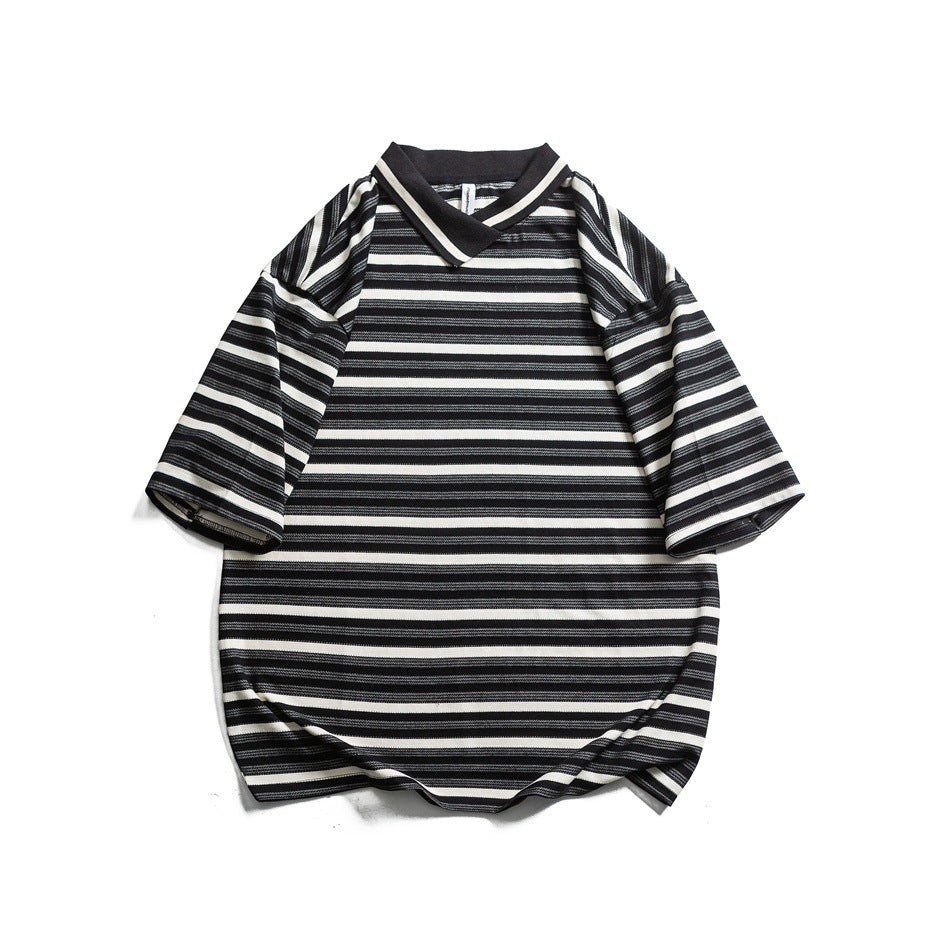 Black short-sleeve T-shirt with white horizontal stripes and a folded V-neck collar, flat lay