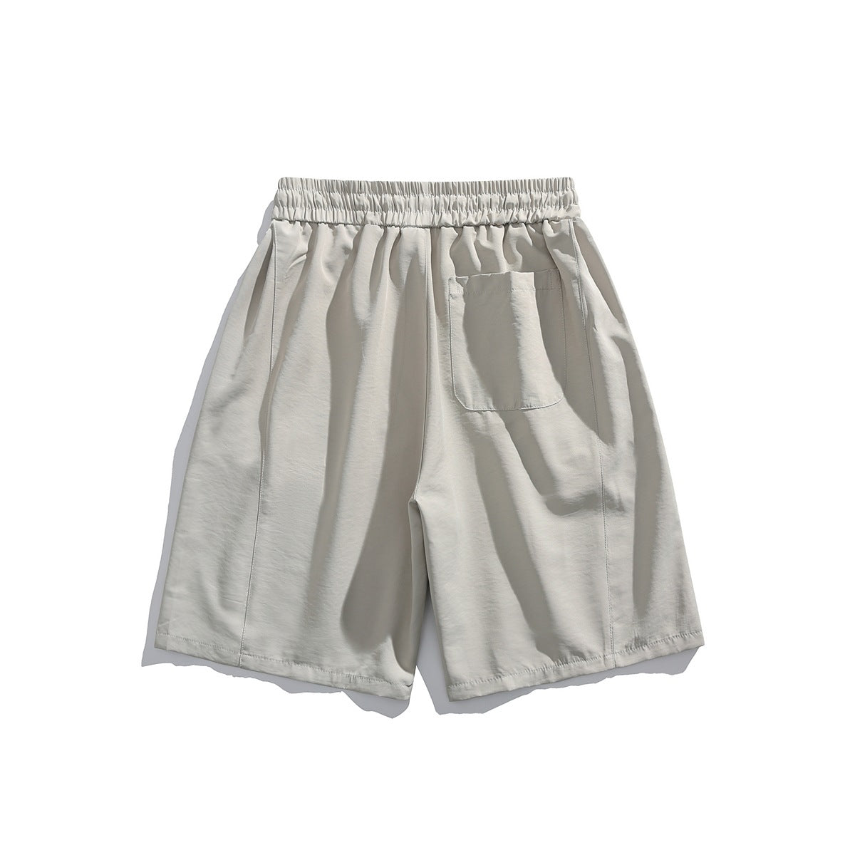 Light gray shorts back view with elastic waistband, back patch pocket and vertical leg seam, flat lay