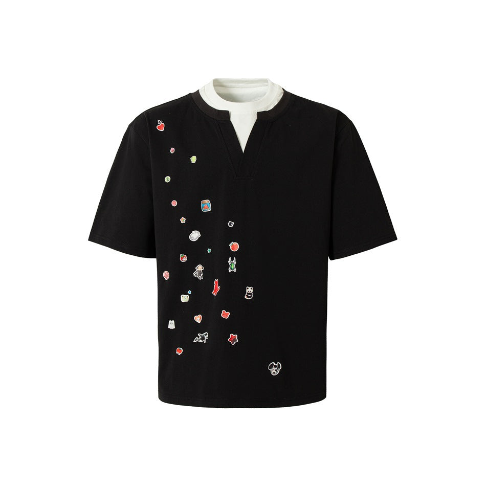 Black short-sleeve T-shirt with white layered collar, notched V-neck and scattered colorful cartoon graphics