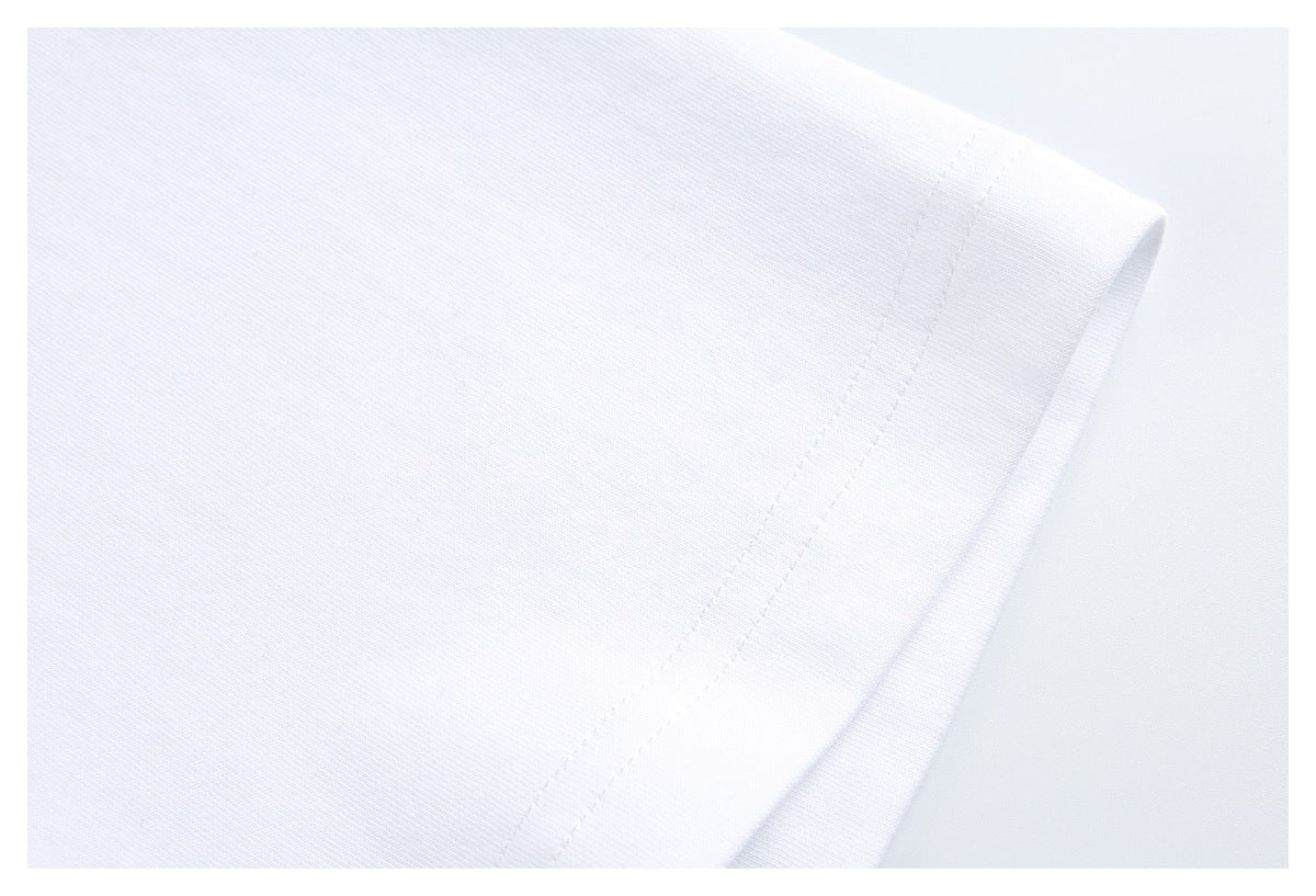 Close-up of a white T-shirt sleeve opening and double-stitched hem.