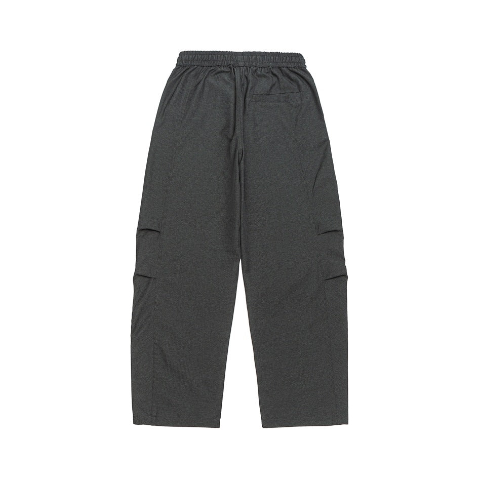 Back view of charcoal wide-leg pants laid flat, showing an elastic waistband and a small rear pocket.