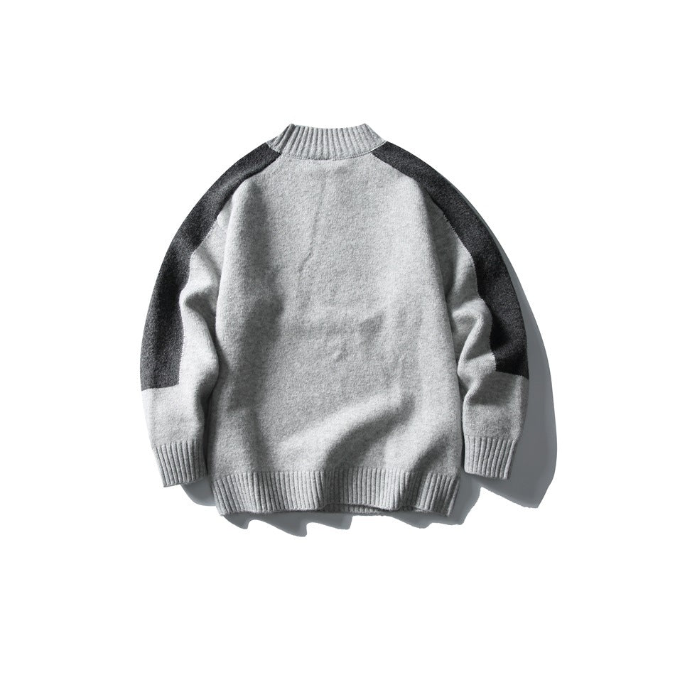 Back view of a light gray crew-neck sweater with charcoal shoulder and upper-sleeve panels.