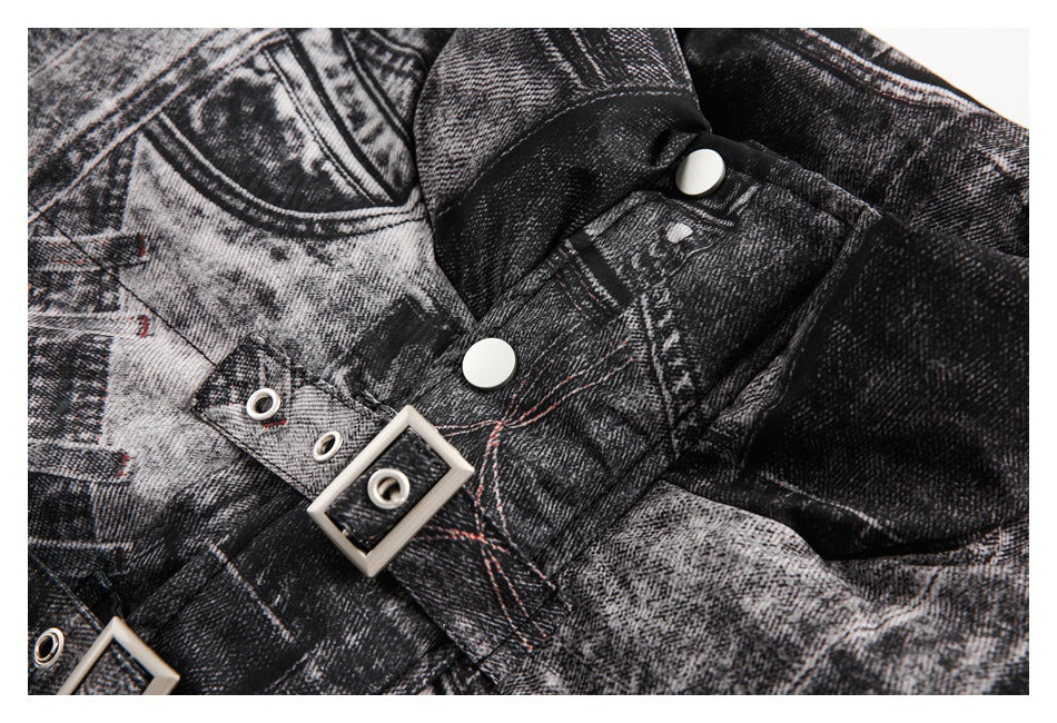 Close-up of the jacket's snap fasteners, buckle strap, and red contrast stitching on its black and gray print.