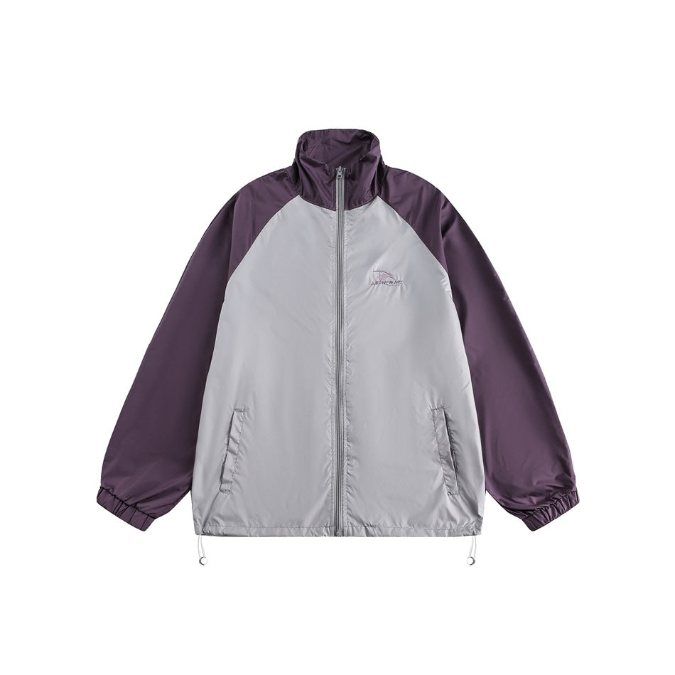 Purple and light gray color-block zip jacket with stand collar, raglan sleeves, elastic cuffs and drawcord hem, front view