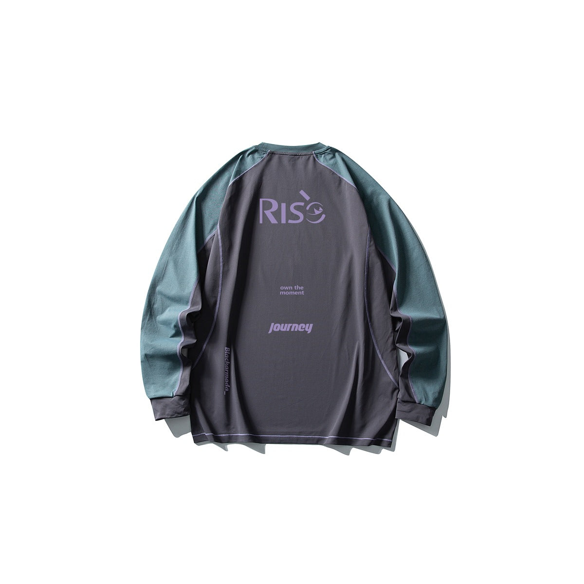 Back of a charcoal shirt with teal sleeves, lavender printed lettering, and contrast seam piping.