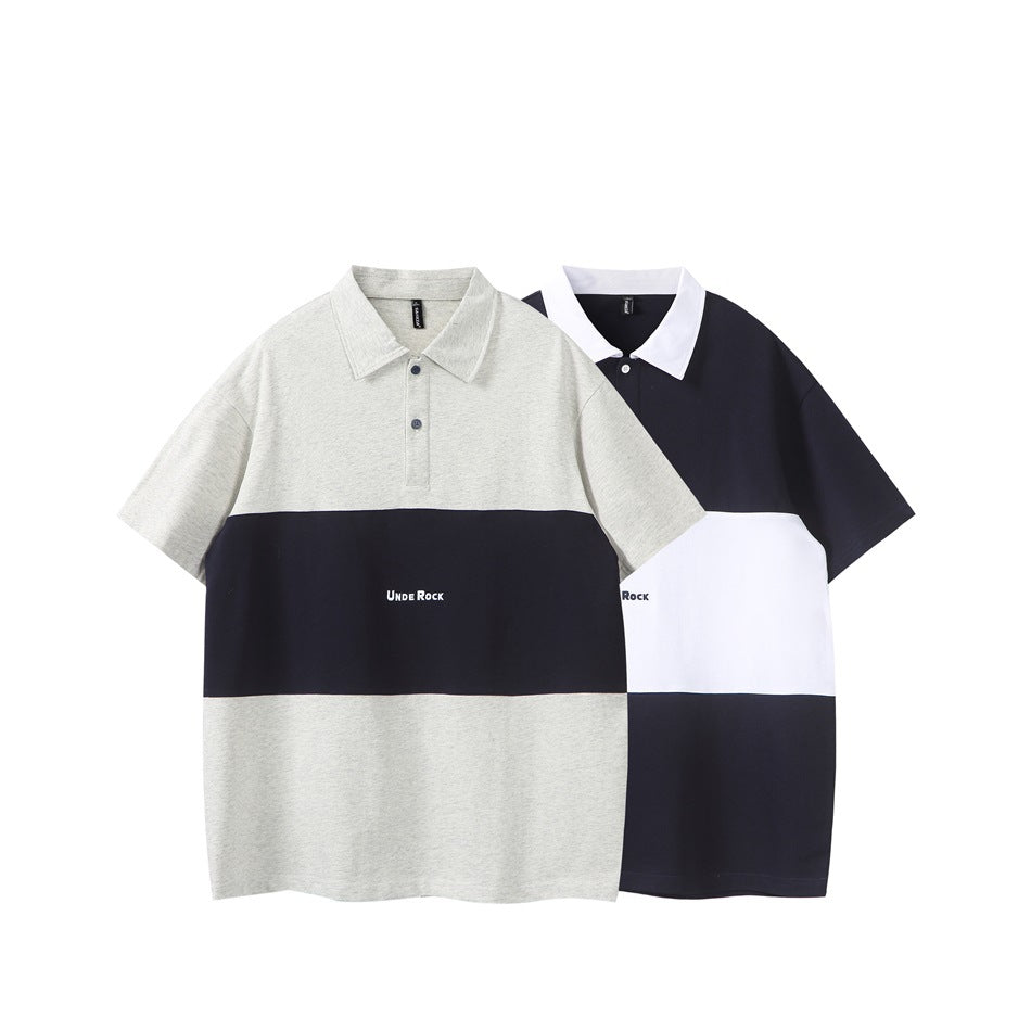 Two short-sleeve color-block polo shirts: gray with a navy chest band, and navy with a white band.