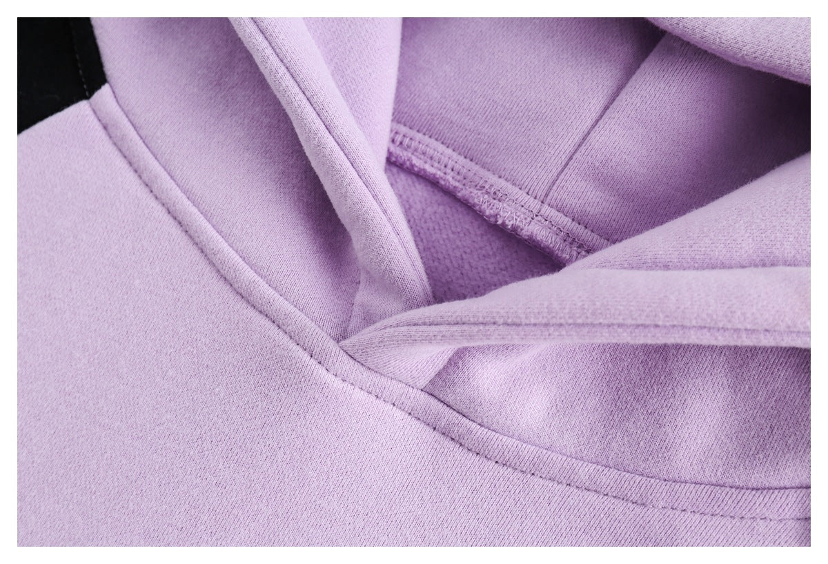 Close-up of the lavender hoodie’s hood lining, stitching, and neckline seam.