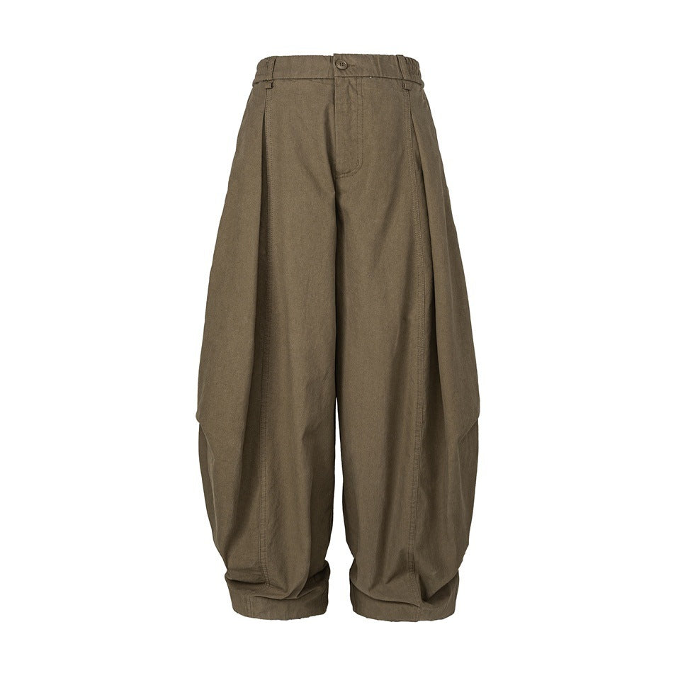 Brown wide-leg balloon pants with elastic waistband, front pleats and cuffed hems, flat front view