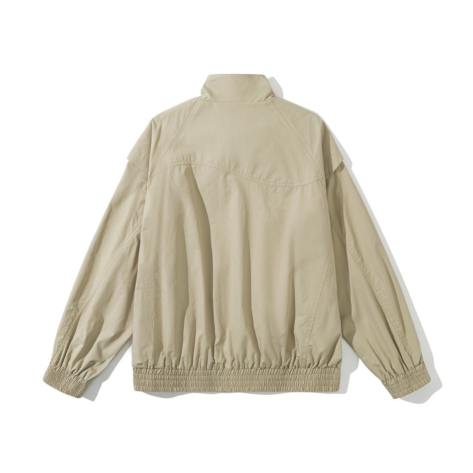 Back view of khaki stand-collar jacket with curved yoke seam and smocked elastic hem and cuffs