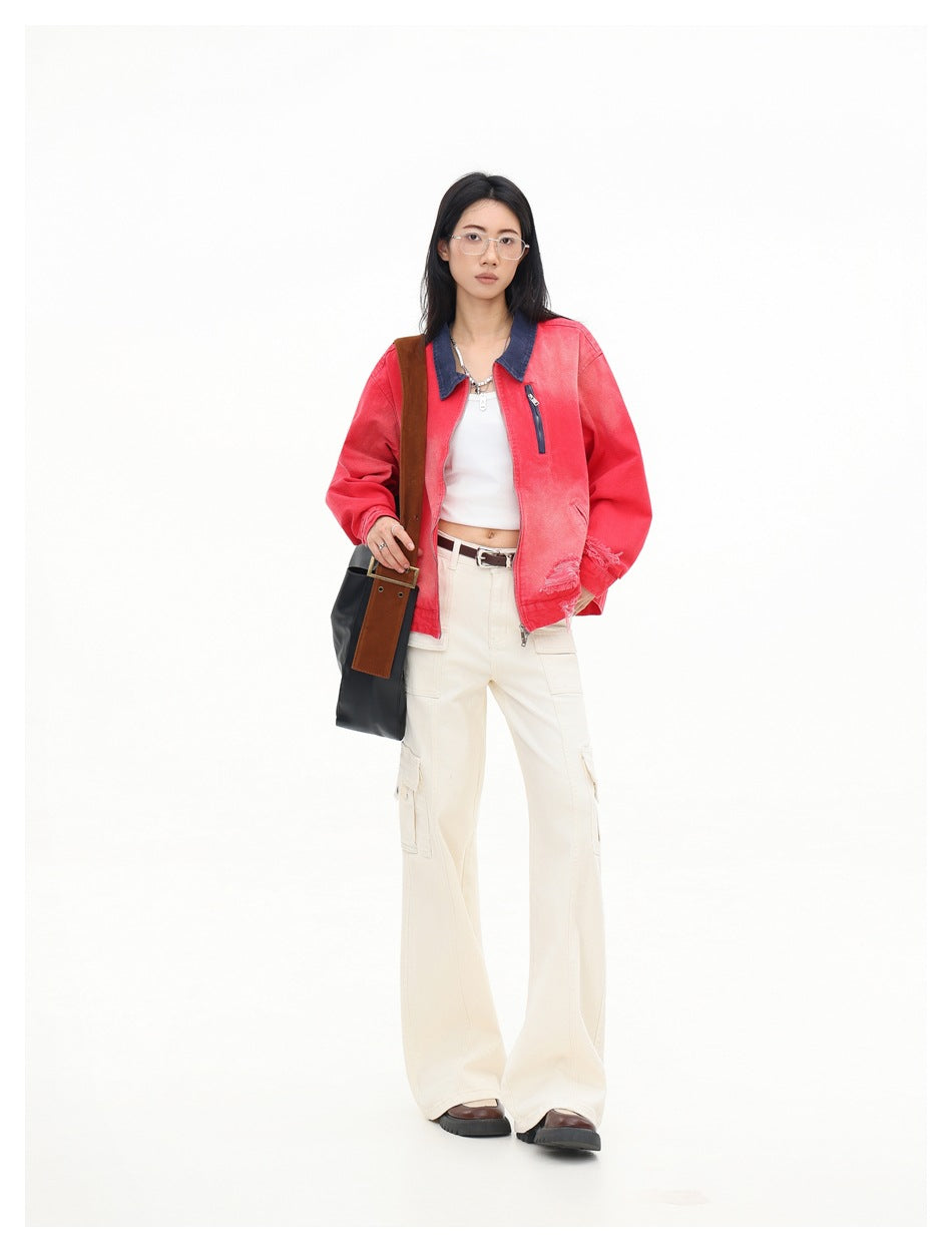 Model wearing the red distressed zip jacket with navy collar, white top and cream cargo pants, full-length view