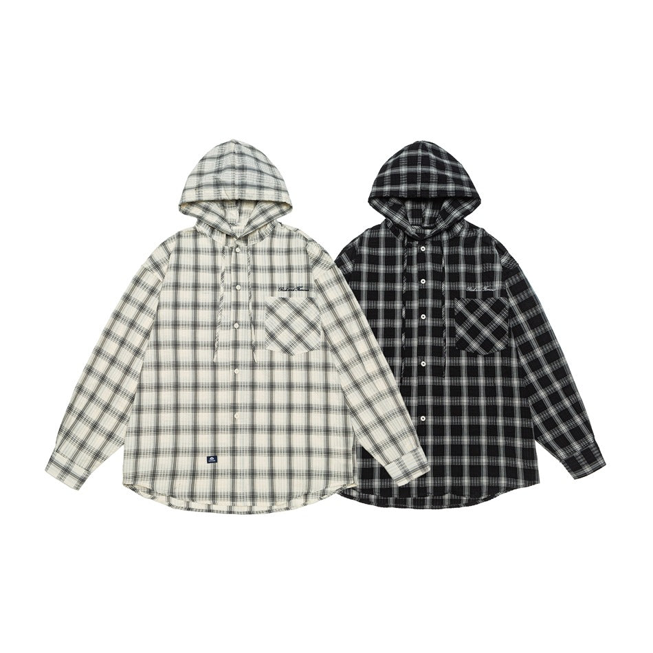 Two hooded plaid button-up shirts shown together: one cream and gray, the other black and gray.