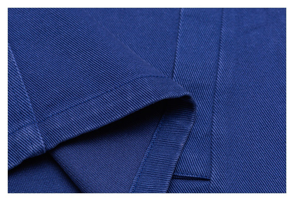 Close-up showing a folded blue garment edge and its interior stitching.