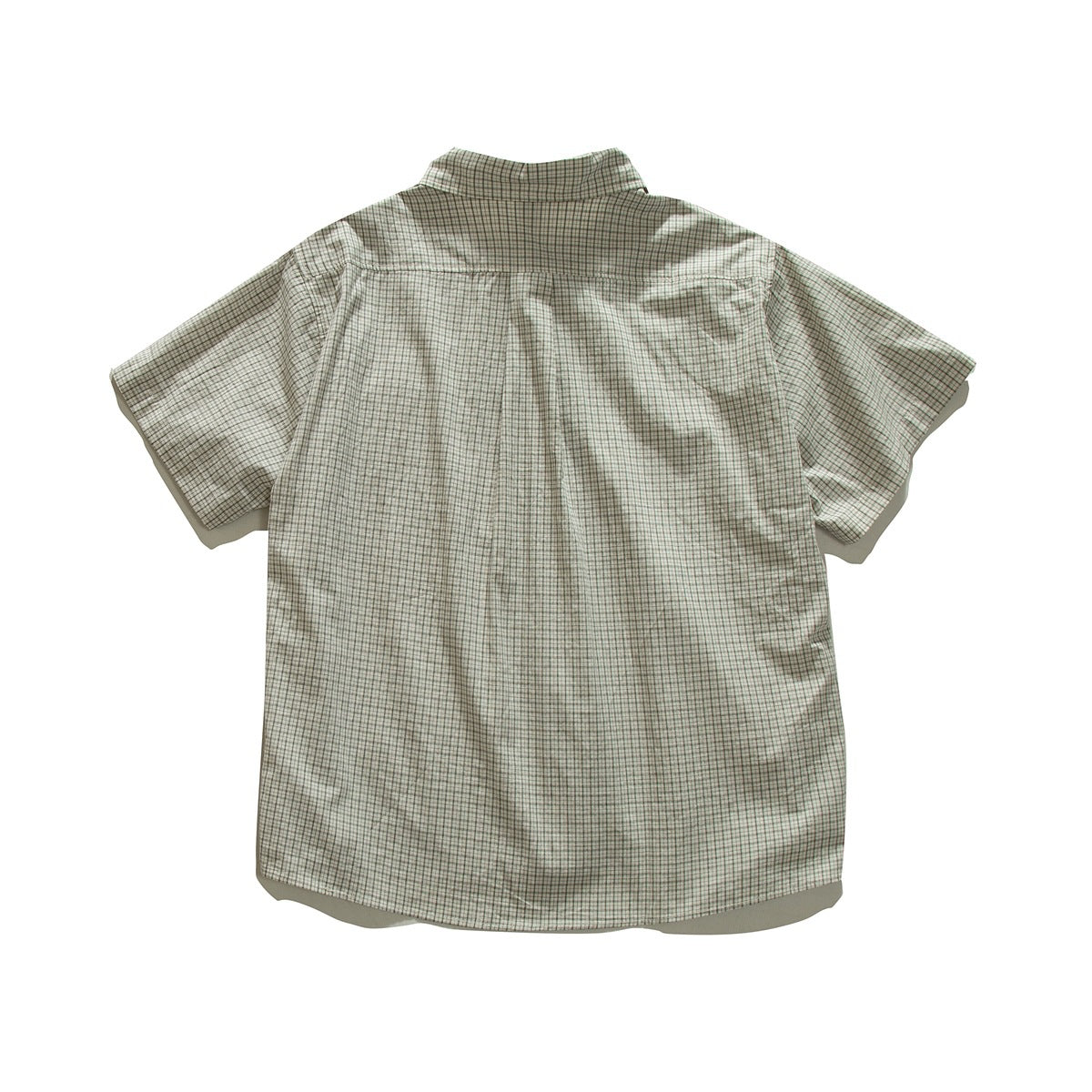 Back view of a short-sleeve cream plaid button-up shirt laid flat against a white background.