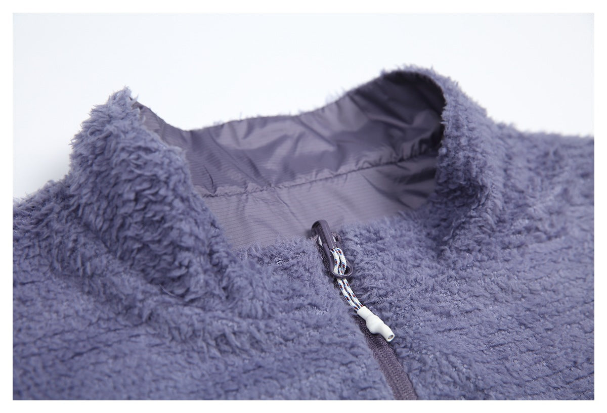 Close-up of the vest's fleece stand collar, inner shell, and zipper pull.