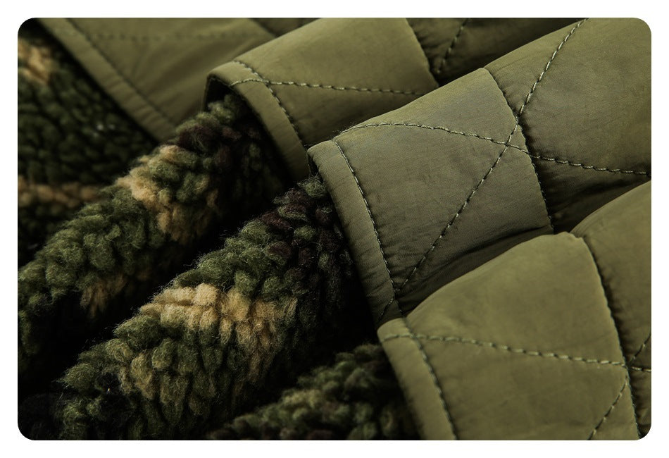 Close-up of olive quilted fabric with a stitched tab and mottled fleece lining.