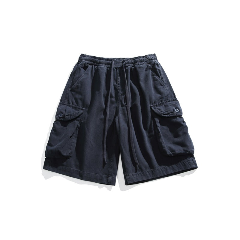 Navy drawstring cargo shorts flat lay with large flap pockets and elastic waistband