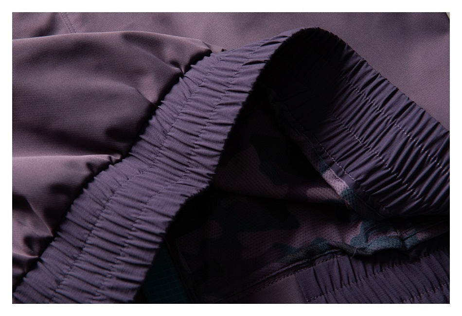 Close-up of gathered elastic waistband and inner lining on a purple garment.