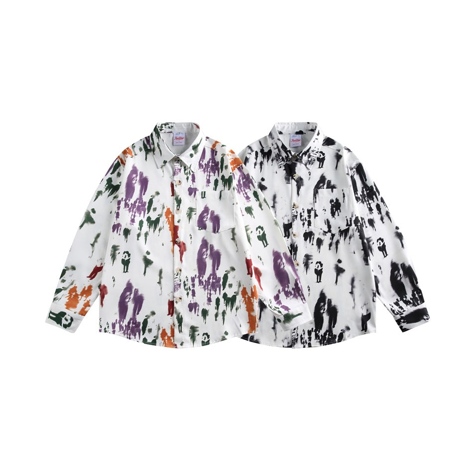 Two button-up shirts displayed together: one white with colorful abstract prints and one white with black prints.