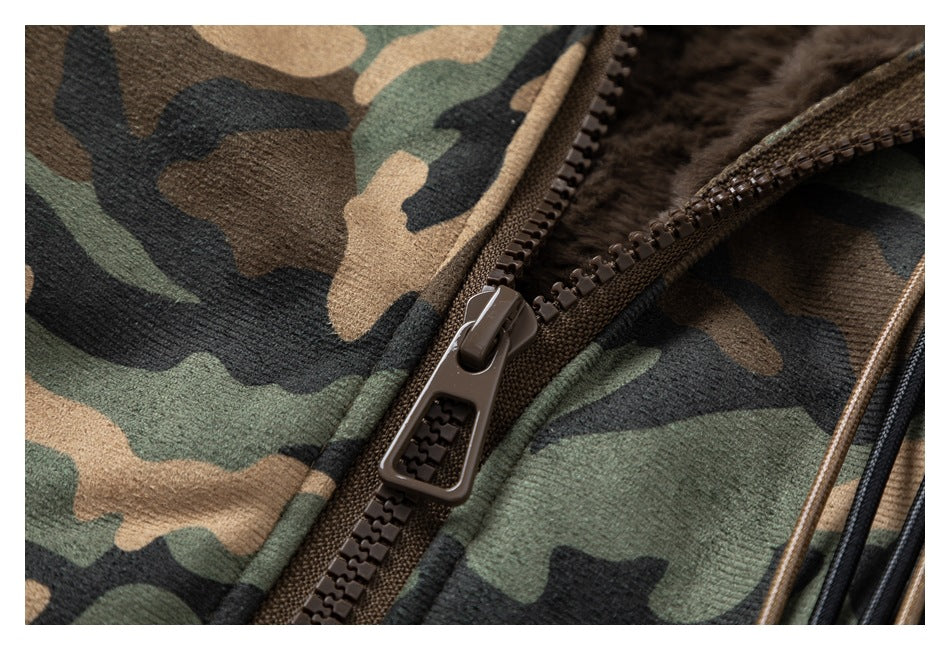 Close-up of a brown zipper on green, tan, and black camouflage fabric with dark brown plush lining.