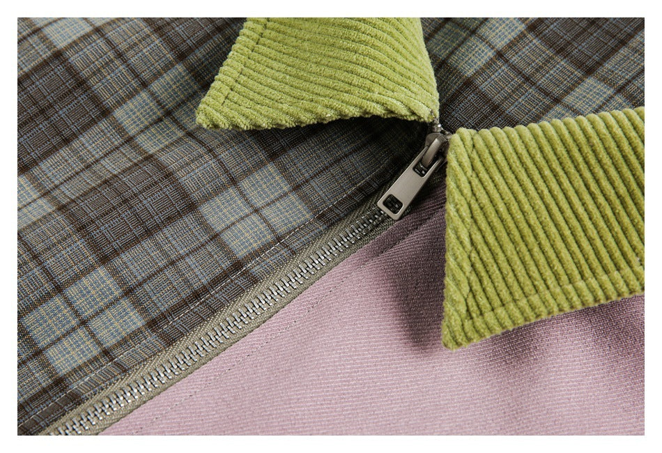 Close-up of a metal zipper joining brown plaid fabric and a mauve panel beneath a lime-green ribbed collar.